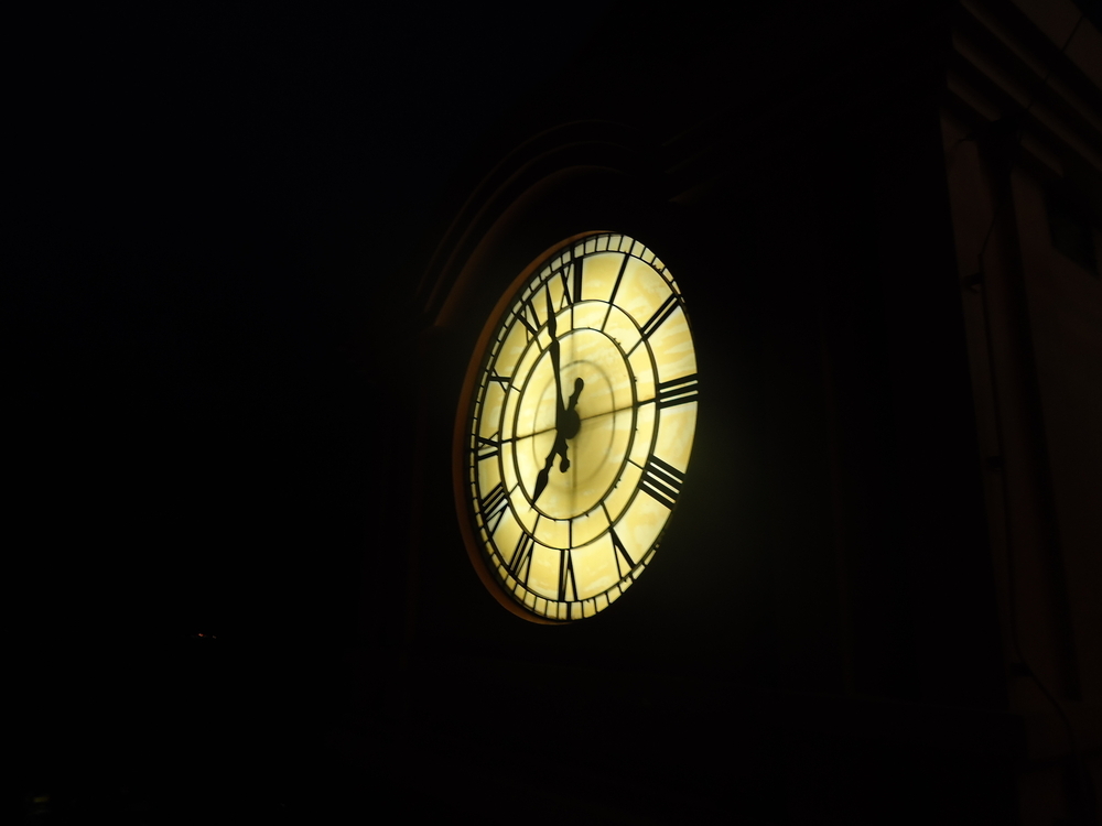 One luminary clock against the sky Acquainted with the Night